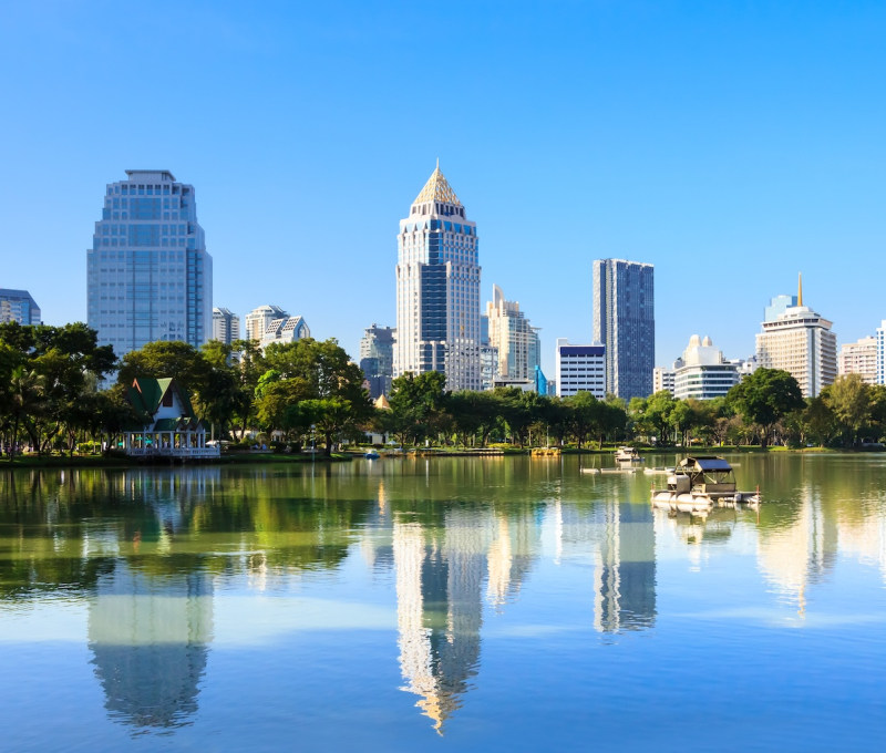 Business district cityscape from a park with blue sky